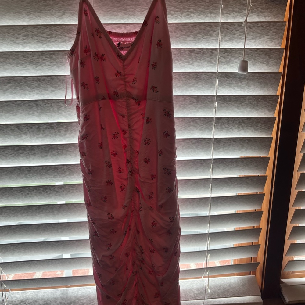 Hollister dress with red flowers on a pink dress in a size XS